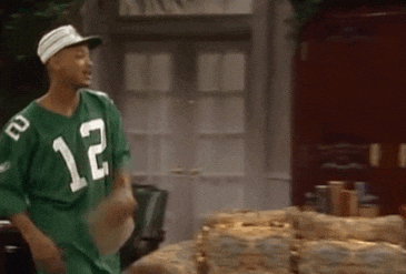 Characters from the Fresh Prince of Bel-Air slapping hands and then moving back